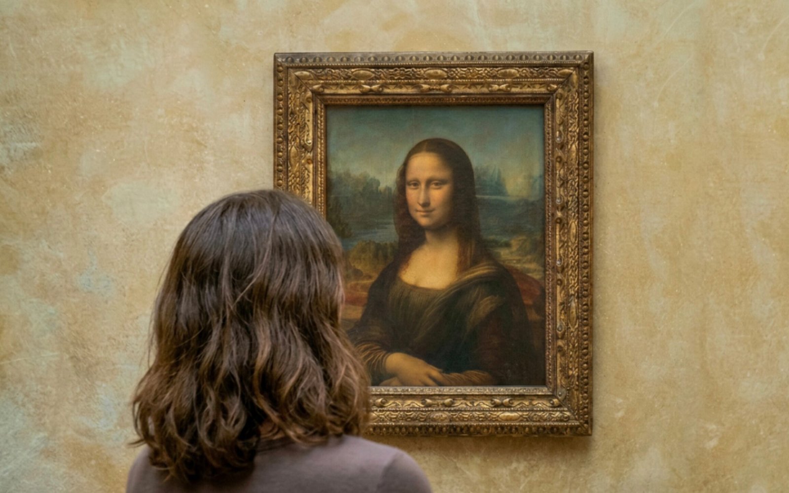 A woman contemplating Leonardo da Vinci's Mona Lisa in a museum, illustrating the human experience of seeing and being seen by a portrait.